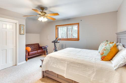 a bedroom with a bed and a ceiling fan at Riverfront Retreat in Nathrop Fire Pits and Hot Tub in Nathrop
