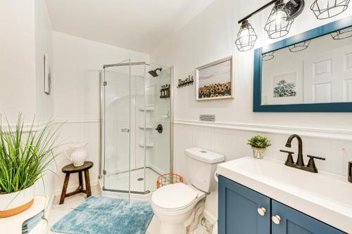 a bathroom with a shower and a toilet and a sink at Deck, Fire Pit and Pool Access at Poconos Retreat! in East Stroudsburg