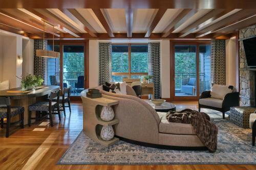 a living room with a couch and a table at The Ritz-Carlton, Lake Tahoe in Truckee