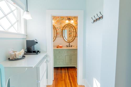 a bathroom with a sink and a mirror at Ocean House Boutique Hotel & Motel in Old Orchard Beach