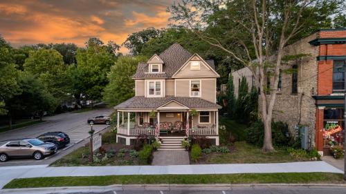 a house on a street with cars parked at Inn of Saugatuck in Saugatuck