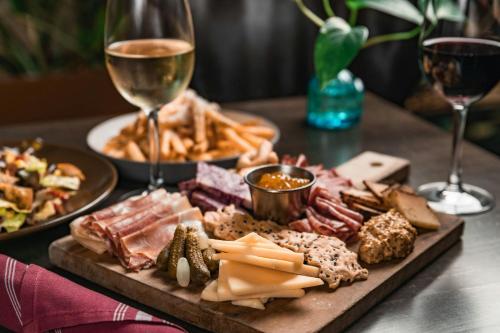 a table with a plate of food and a glass of wine at Sheraton Austin Georgetown Hotel & Conference Center in Georgetown