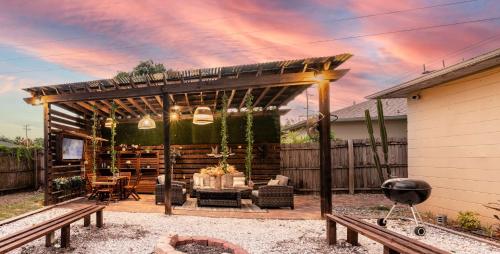 a patio with a pergola and a grill at Upscale Ybor House with Outdoor Living Space in Tampa