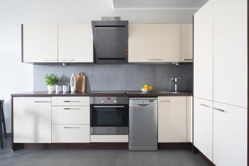 Η κουζίνα ή μικρή κουζίνα στο Apartamenty Olimpic