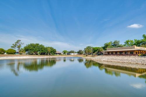 a river with a building in the background at Golf and Pool Access Home with Yard in Lady Lake in Lady Lake