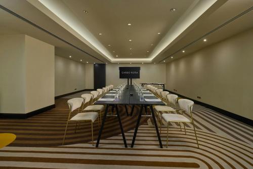 a long conference room with a long table and chairs at Cardo Roma, Autograph Collection in Rome