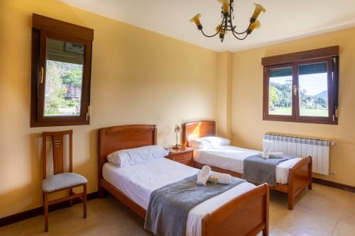 Ένα ή περισσότερα κρεβάτια σε δωμάτιο στο Villa Urdaibai