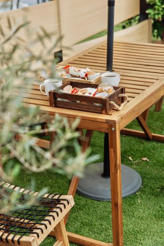a picnic table with food on top of it at Geometry Park in Ayios Theodhoros