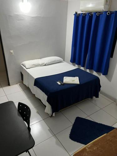 Una cama o camas en una habitación de Hotel e pousada Chalana