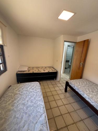 Katil atau katil-katil dalam bilik di Casa Gravatá - 2 quartos