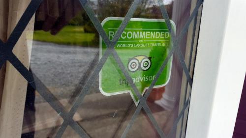 a door with a green container with a face on it at Ely House B&B in Shannonbridge