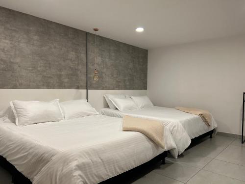 Postel nebo postele na pokoji v ubytování Hotel 79 Poblado
