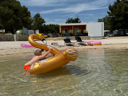 a young boy is in an inflatable at Villa Benisa beach in Drage