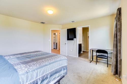 a bedroom with a bed and a desk at Less Than 20 Mi to Dtwn Austin Home in Quiet Neighborhood in Manor
