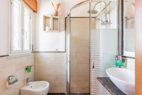 a bathroom with a sink and a shower at Villa Giummarito in Scicli