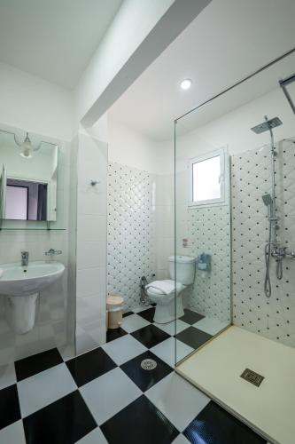 a bathroom with a sink and a toilet and a shower at Hotel Artur2 in Ksamil