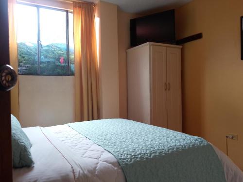 Postel nebo postele na pokoji v ubytování Hotel Amazonia y sol