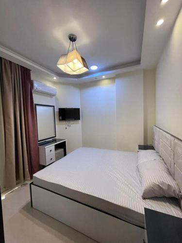 Ένα ή περισσότερα κρεβάτια σε δωμάτιο στο Casablanca Beach for families only