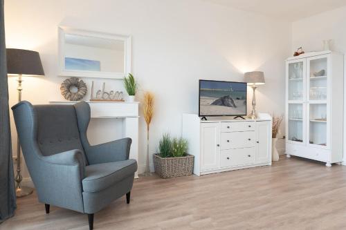 TV a/nebo společenská místnost v ubytování Haus Hasenkamp 26 Hasenbau
