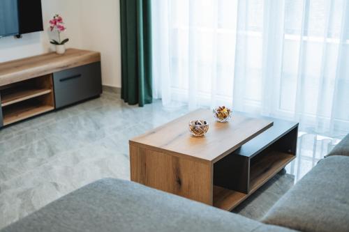 a living room with a coffee table and a couch at ARA Lux Apartments in Utjeha