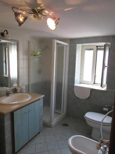 a bathroom with a sink and a toilet at MareLuna B&B in Naples