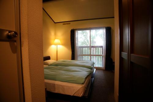 Una cama o camas en una habitación de Hotel Andermatt