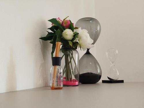 a group of vases with flowers and a glass orb at Carneval and Tuscany in Viareggio