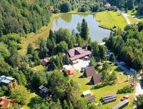 an aerial view of a lodge next to a lake at Sabinka pri jazere in Spišské Vlachy