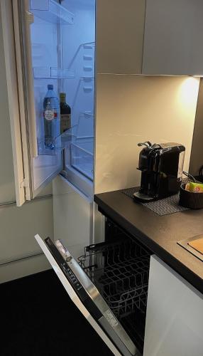 a kitchen with an oven with a bottle of water at Smart 82 in Tartu