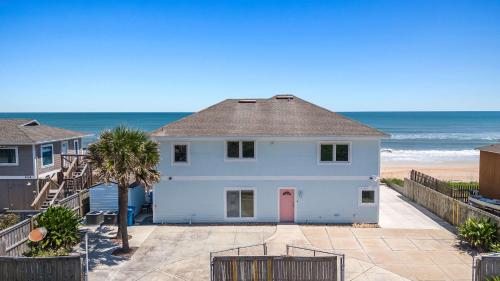 a white house with the ocean in the background at New 5 Bedrooms 3 full and 2 1 2 Bathroom Oceanfro in Ponte Vedra Beach