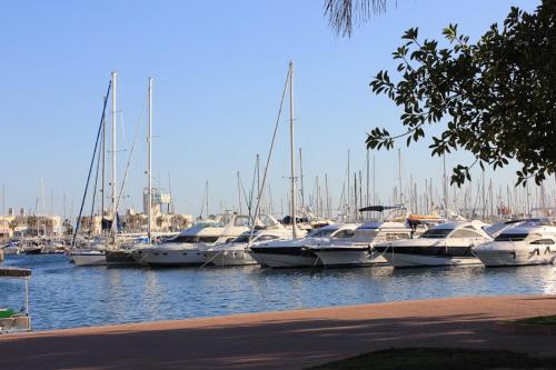 a bunch of boats docked in a harbor at Apartament Solar in Alicante