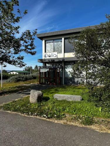 a building with a sign on the side of it at Dalía in Búðardalur