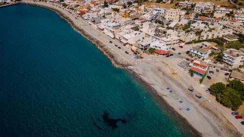 an aerial view of a beach and the ocean at Eftihia Studios Paleochora in Palaiochóra