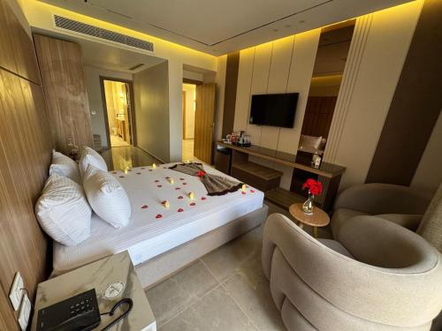a hotel room with a bed and a couch and a chair at Ramage Hotel & Resort in Cairo
