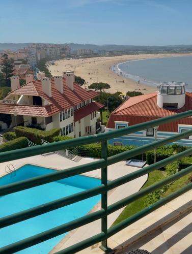 a view of the beach from the balcony of a resort at Beach Views-Ocean Breeze-Duplex Dreams in São Martinho do Porto