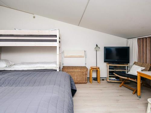 En eller flere senge i et værelse på Cozy Retreat in Sondervig - By Traum Ferienwohnungen