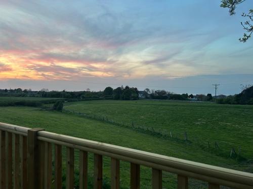 a view of a field from a fence at Fernlea Luxury Shepherds Hut & Hot Tub in Boosbeck