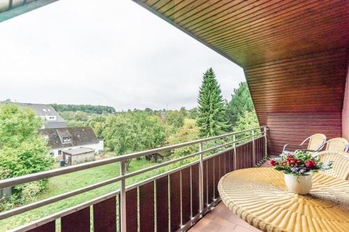 a balcony with a table and chairs and a view at Schmiedestraße 3 Wohnung 7 in Klein Grönau