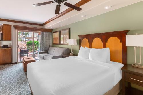 a bedroom with a large bed and a living room at Hilton Vacation Club Sedona Summit in Sedona