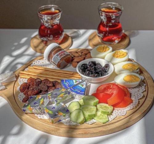 a tray of food with eggs and vegetables on a table at Julia Rum Luxury Camp in Wadi Rum