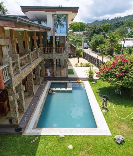 an overhead view of a house with a swimming pool at Tabularasa - T Palawan in San Vicente