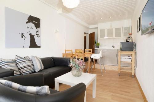 TV a/nebo společenská místnost v ubytování Blankwasserweg 131 Lensterstrand Oase Bungalow 4