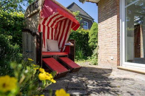 a lawn chair with an american flag on it at Haus Sommerzeit in Fissau