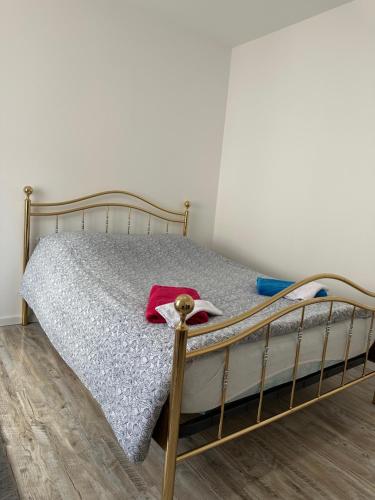 a bedroom with a bed with a metal frame at La bulle du 4 in Épernay