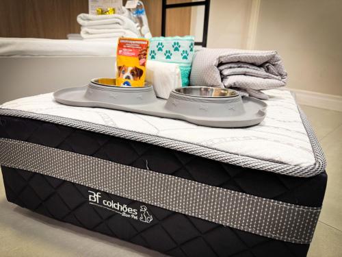 a bed with a tray on top of it at Hotel São José in São José