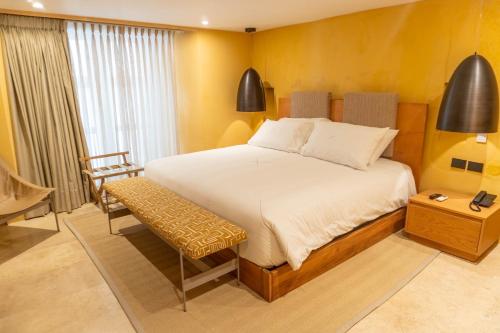 Postel nebo postele na pokoji v ubytování Casa Carolina Hotel Cartagena