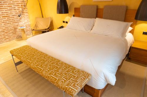 Postel nebo postele na pokoji v ubytování Casa Carolina Hotel Cartagena