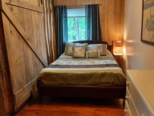 Ένα ή περισσότερα κρεβάτια σε δωμάτιο στο Wymbolwood Lodge