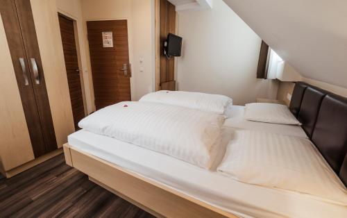 Postel nebo postele na pokoji v ubytování Hotel Flair