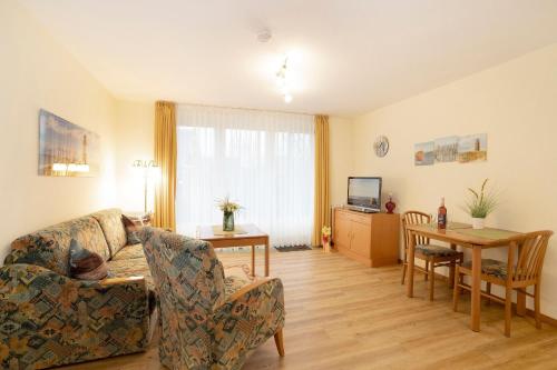 TV a/nebo společenská místnost v ubytování Lindenbuschen 2 Wohnung 3